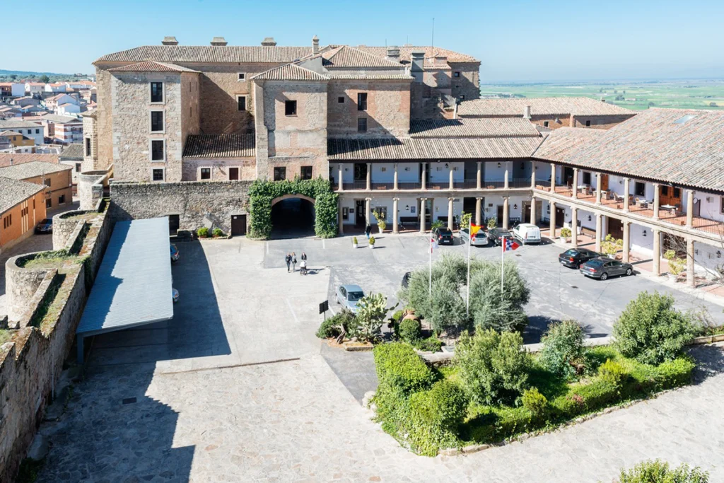 Aerial view of Parador de Oropesa courtyard and medieval castle-hotel