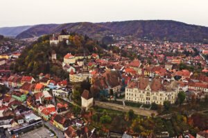 Aerial view of Sighișoara Citadel and colorful medieval rooftops