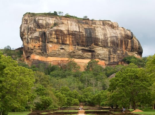 View of Sigiriya rock fortress rising above jungle