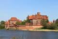 Malbork Castle Seen Across the Nogat River on a Clear Day